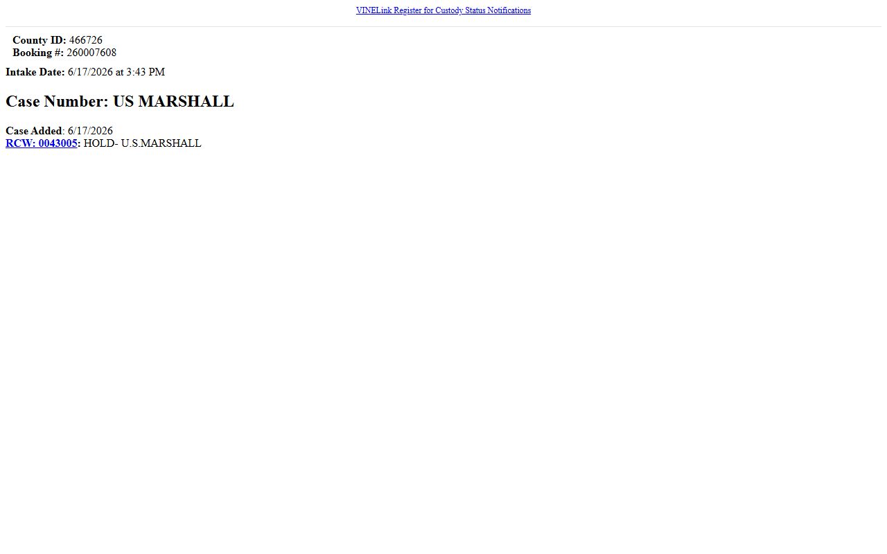 Spokane County inmate record detail with booking number and charge fields